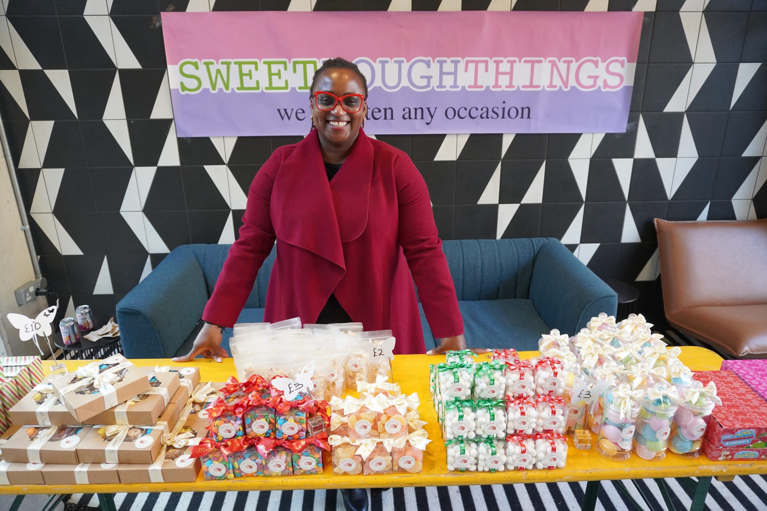 Photo of Gbemi Shitta in Front of Sweet Stall